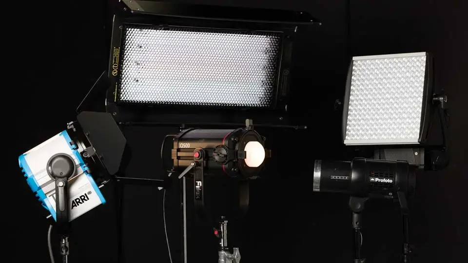 Softboxes and lighting fixtures hung from the studio ceiling grid