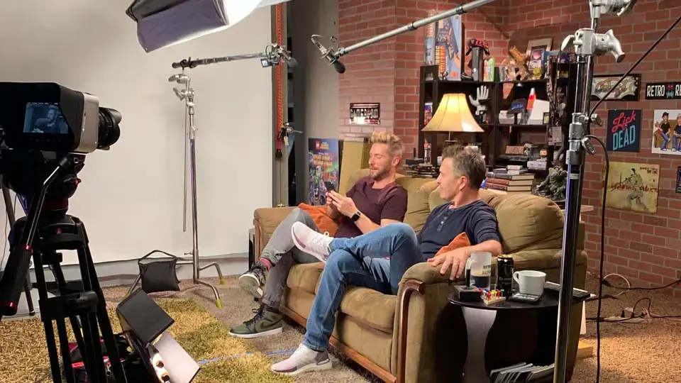 Interview set with lights hung from the overhead studio grid above the stage