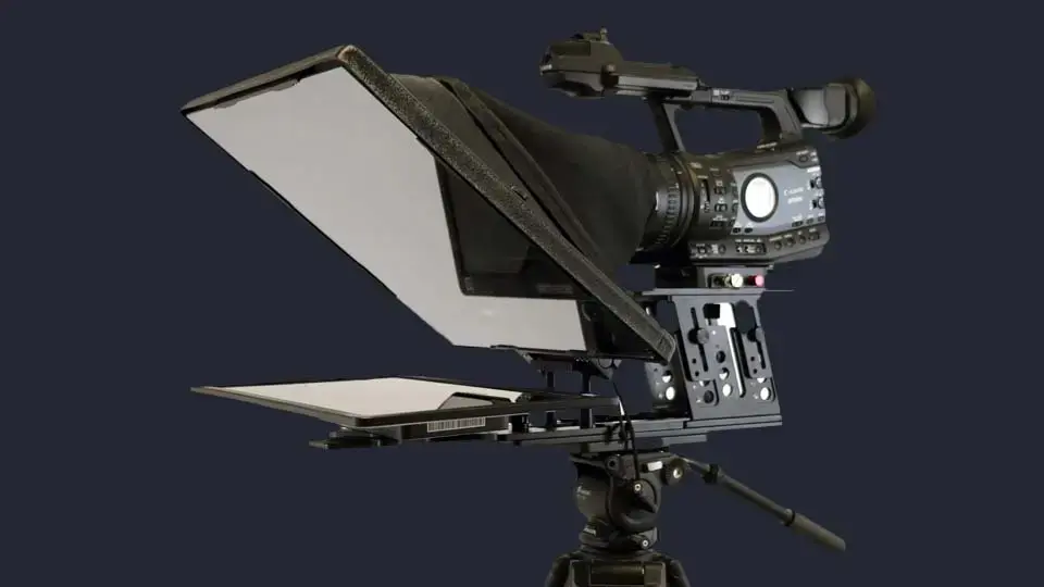 Teleprompter on a stand among miscellaneous production tools in the studio